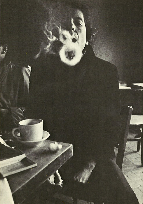 Leonard Cohen blowing smoke rings by Jim Wigler